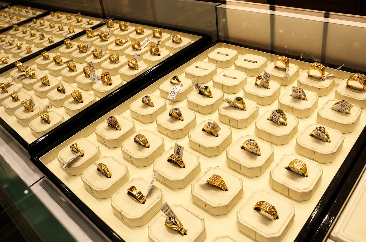 Diamond ring being inspected closely on a dark surface